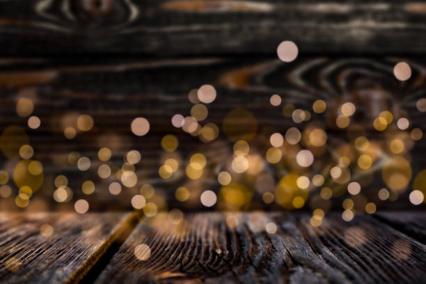istock Festive dark brown background with Christmas lights 1445563233