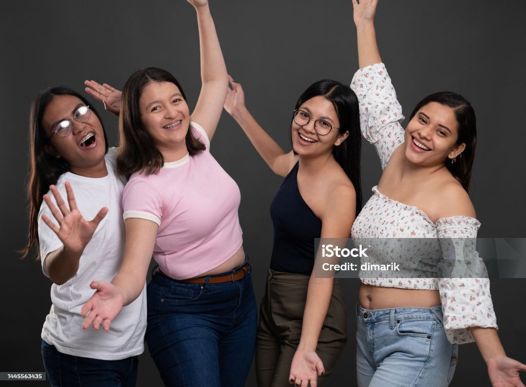 Portrait of group happy young people Portrait of group happy young hispanic people on studio background Indigenous Peoples of the Americas Stock Photo