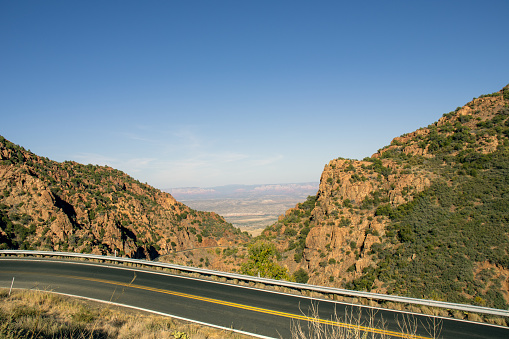 Highway 89a winding its way down the mountain to the old mining town of Jerome, Arizona, overlooking the Verde Valley and the Red Rocks of Sedona.