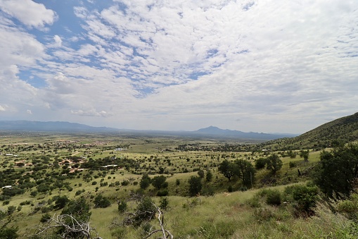 A couple miles north of the border to Mexico, the Huachuca Mountains and the southwestern landscape during summer.