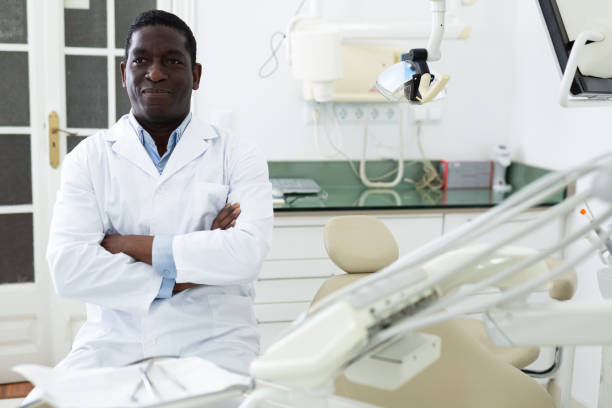 istock Smiling man orthodontist looking at camera 1445566727
