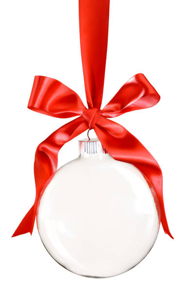 istock Clear Christmas ornament hanging from shiny red ribbon and bow. Empty space in bauble for text or product. Isolated on white. 1445566793