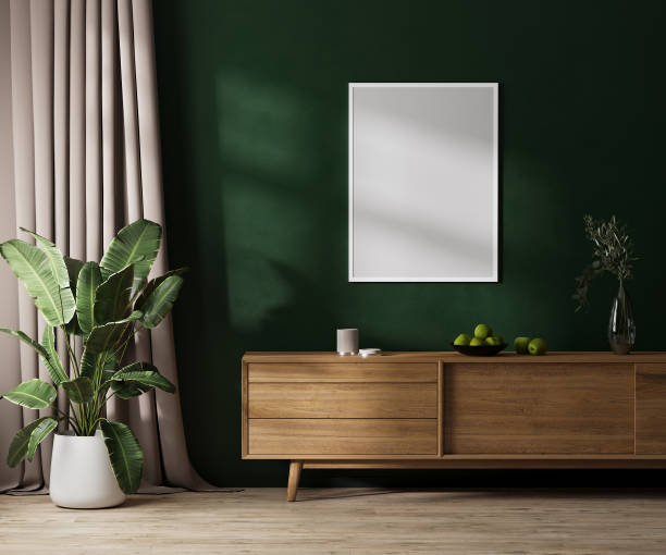 istock blank poster frame mock up on green wall with sunlight, modern room interior with wooden furniture, curtain and plant in pot, 3d render 1445575853