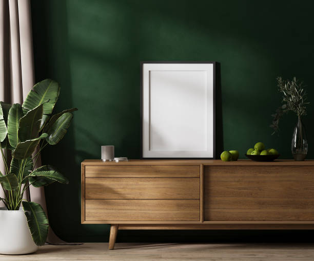istock Empty poster frame mock up with mat on dresser in modern room interior with green wall with sunlight, curtain and green plant, 3d rendering 1445575879