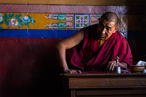 Diskit, India - September 6, 2011: Tibetan Buddhist monk in Diskit gompa on September 6, 2011 in Diskit, India. Diskit gompa is the oldest and largest Buddhist monastery (gompa) in the Nubra Valley of Ladakh, India