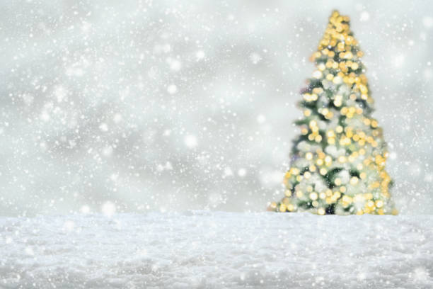 istock Empty white snow with blur Christmas tree with bokeh light background 1445579930