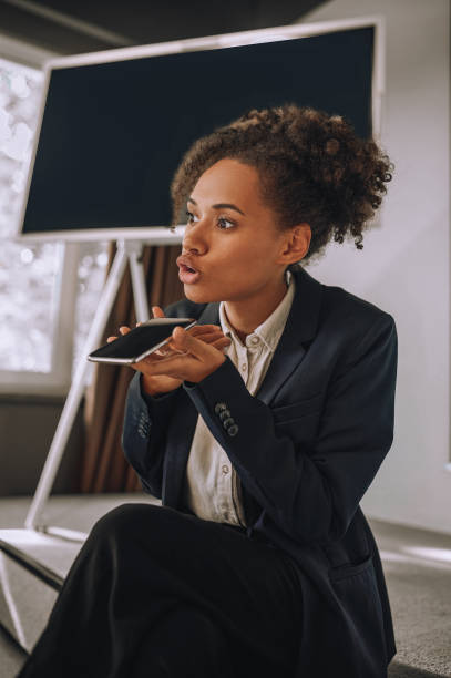 istock Woman speaking her thoughts on smartphone voice recorder 1445580039