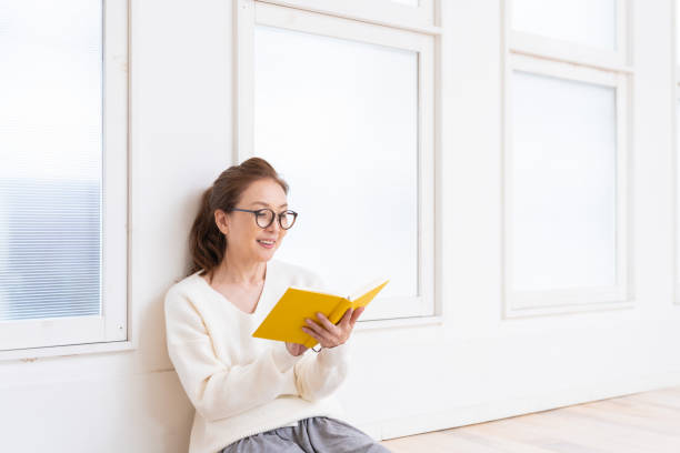 istock senior age woman who reads a book 1445581601