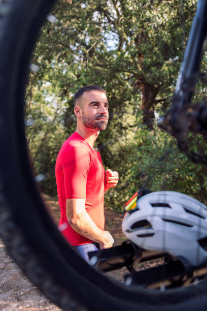 istock man dressing next to his van to go cycling 1445585051