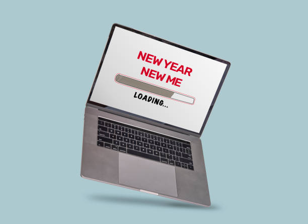 istock New Year New Me theme loading on laptop screen with blue background 1445597848