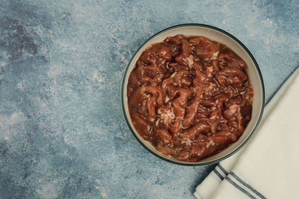 istock Fresh marinated pork on boww, ingredients for Thai style barbecue grill or Moo Krata 1445600450