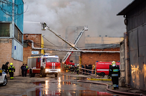 December 13, 2019, Moscow, Russia. A fire brigade extinguishes a fire in an industrial quarter.