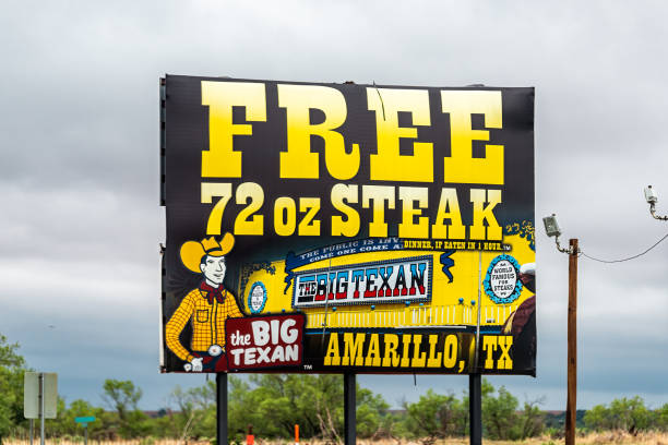 Closeup of billboard for free 72oz steak food challenge at the Big Texan restaurant burger steak ranch in Texas city stock photo