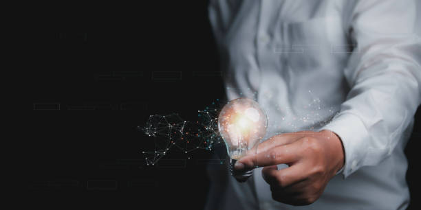 istock Businessman holding a bright light bulb. Concept of Ideas for presenting new ideas. 1445602282