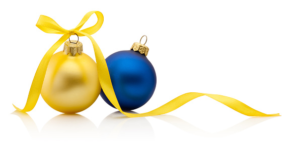 Christmas baubles in Ukrainian colors with ribbon bow isolated on white background