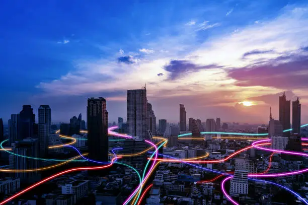 Smart city with speed line glowing light trail surround the city. big data connection technology concept.