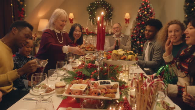 Happy family serving Christmas table