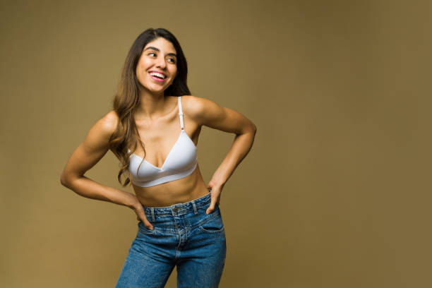 istock Beautiful woman laughing while wearing underwear 1445621422