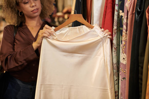 istock Woman Looking at Silk Skirt 1445622758