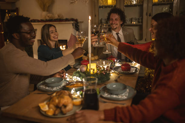 istock Friends toasting on Christmas dinner at home 1445630258