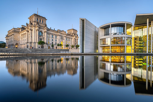 The Reichstag and the Paul-Loebe-Haus at the river Spree in Berlin at twilight