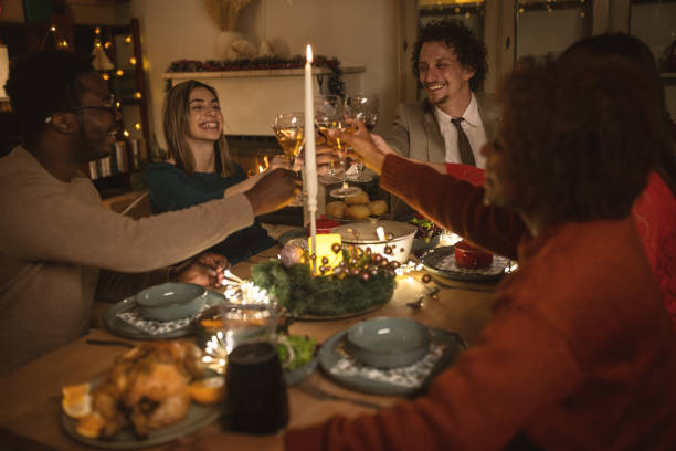 istock Friends toasting on Christmas dinner at home 1445631096