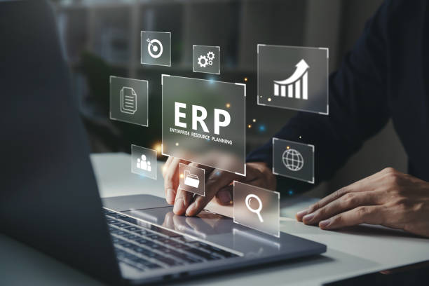 istock Businessman using laptop with ERP icon on virtual screen. 1445631118