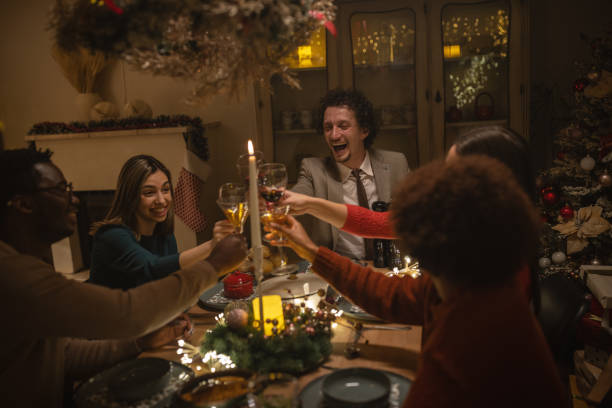 istock Friends toasting on Christmas dinner at home 1445631552
