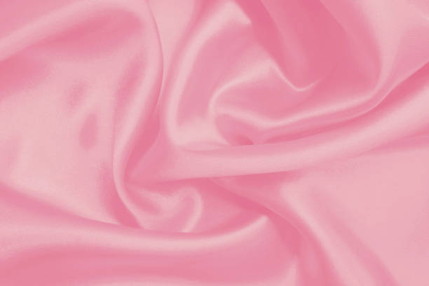 istock Soft pink fabric texture background, detail of silk or linen pattern. 1445631569