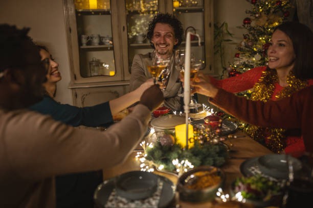 istock Friends toasting on Christmas dinner at home 1445632749