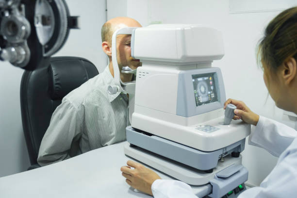 istock Man examining eyesight in optical clinic. 1445633971