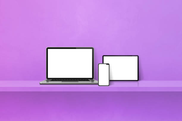 istock Laptop, mobile phone and digital tablet pc on purple wall shelf. Horizontal background 1445636189