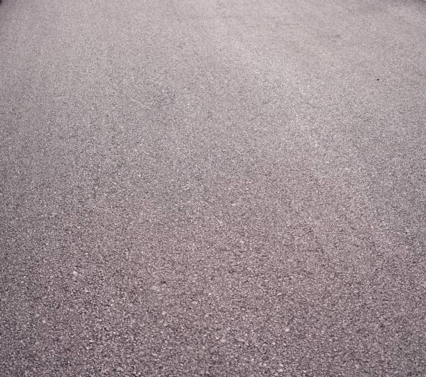 istock The image shows a road surface with black asphalt that has just been poured onto the road surface, Close up. 1445636403