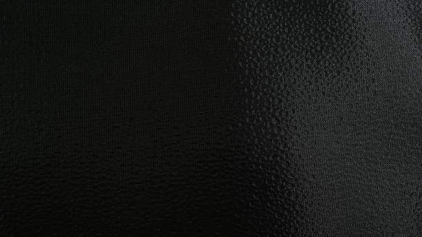 istock Closeup of black sequin fabric material as a background 1445640687
