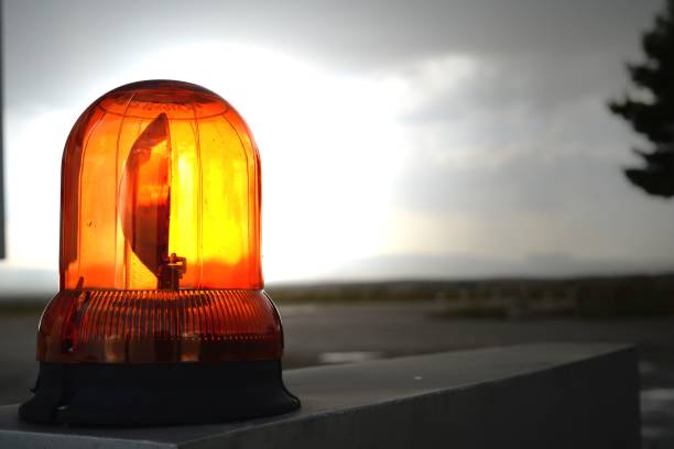 istock Closeup shot of an illuminated orange warning caution light 1445641055