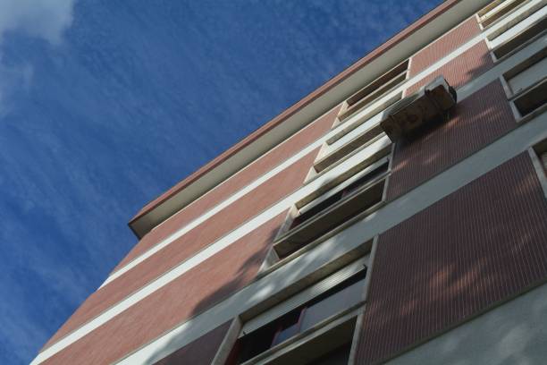 istock Low angle view of a modern apartment building under the blue sky 1445641146