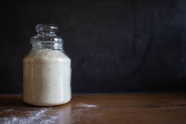 istock Flour in a jar on a wooden table 1445642586