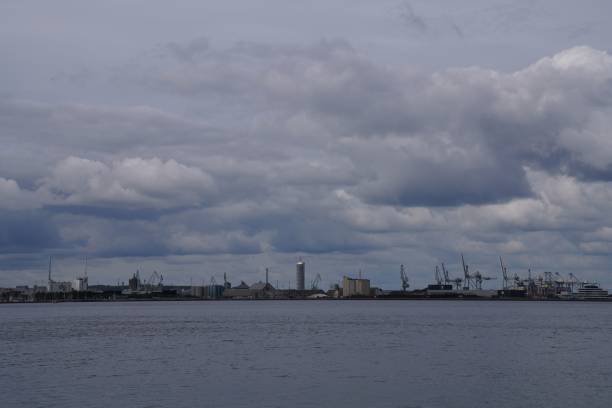 istock Beautiful view of a calm sea and a construction site in a background 1445642973