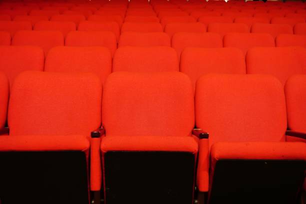 istock Empty theater seats in perfect rows indoor 1445643044