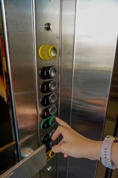 istock Closeup shot of a woman hand on the elevator button 1445644752