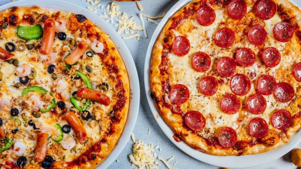 istock Top view of two kinds of pizzas 1445645047