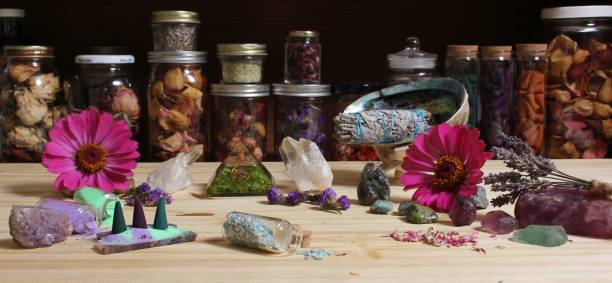 Meditation Altar With Incense Cones and Flowers on Rustic Table With Rock Crystals Meditation Altar With Incense Cones and Flowers on Rustic Table With Chakra Crystals crystal altar stock pictures, royalty-free photos & images