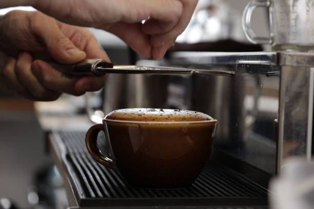 istock Person making an artistic coffee at the bar 1445648049