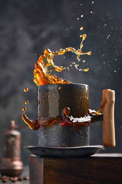 Vertical shot of coffee cup with splash