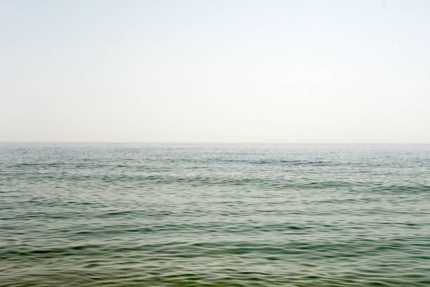 istock Beautiful scene of a seascape under a cloudless sky 1445649505