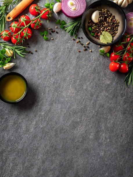 vegetables and spices on the kitchen table with copy space top view. dark cooking food background - rosemary food herb cooking imagens e fotografias de stock