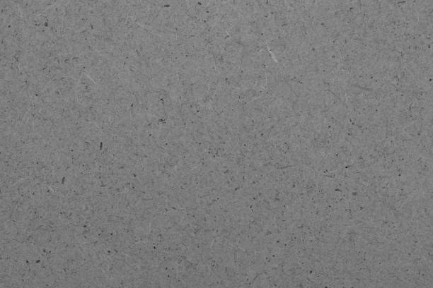 istock Gray cardboard texture background with black markes on it 1445650816