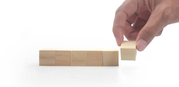 istock Wooden blocks in hand space and word decide 1445651825