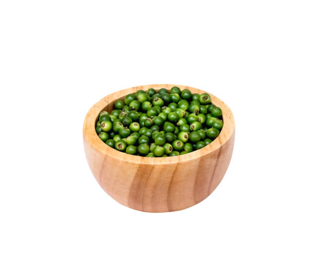 istock Piper nigrum (black pepper) in wood bowl isolated on white background , clipping path 1445653966