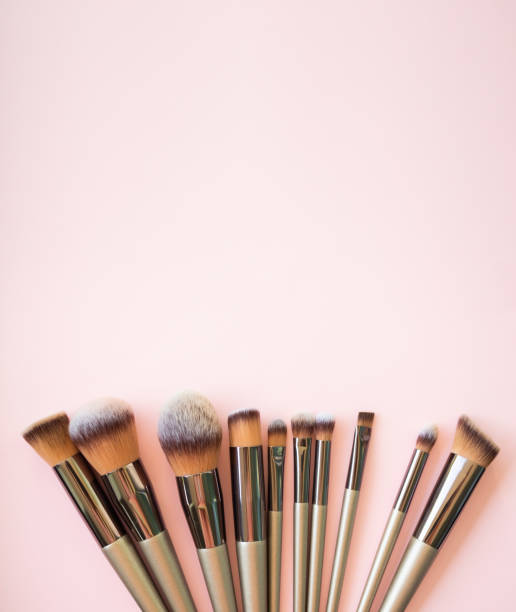 istock Make Up brush Set Flat Lay on Pink Background with Free Space 1445653973